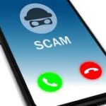 Smartphone screen showing incoming scam call with cartoon thief icon and red and green call buttons